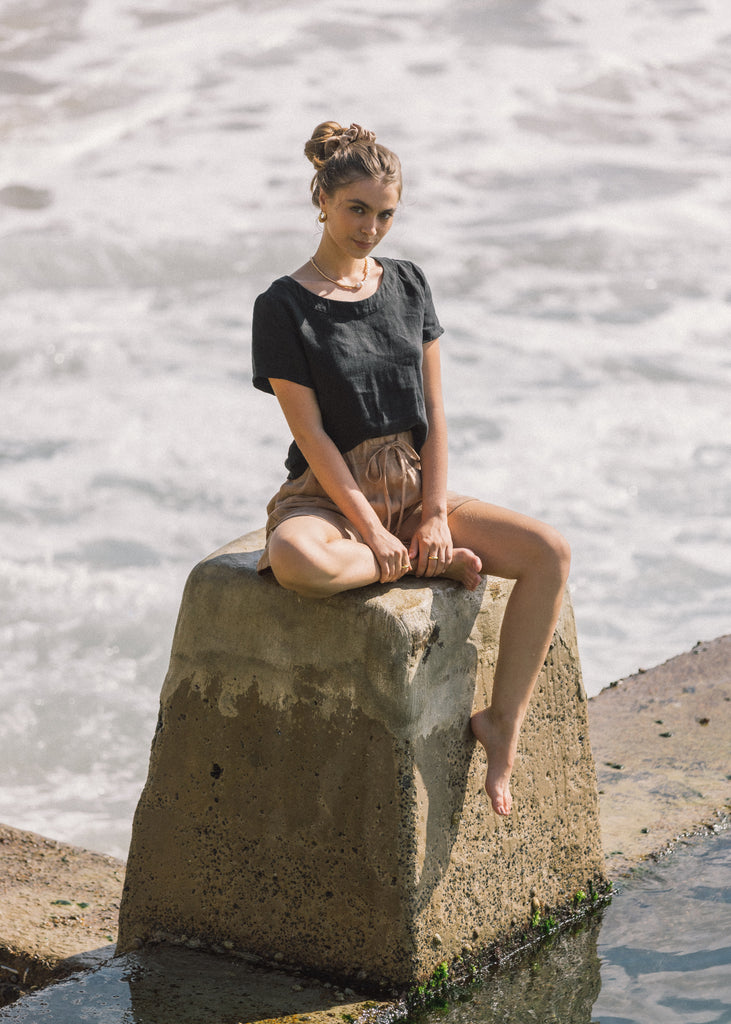 The Augusta Top in Black paired with The Talia Short in Almond. 