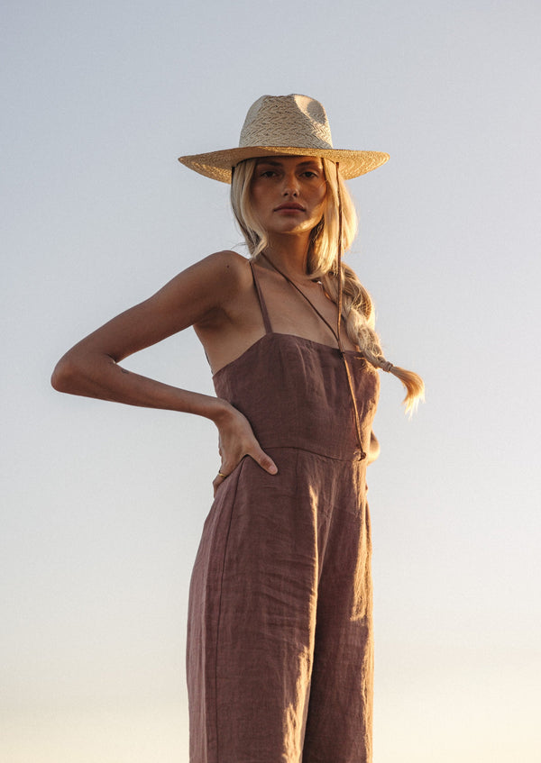 The Marlo Jumpsuit embodies a classic silhouette with a fitted bodice that is double-lined with linen, has adjustable straps, and a zip down the center-back. The&nbsp;easy, wide-leg pant allows for movement and comfort while looking effortlessly chic. Take this piece through the seasons with your favourite pair of sandals or pair it with a chunky knit in the cooler months.