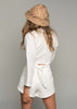 The Avalon Set in White linen. Shot in studio and styled with a straw hat. 