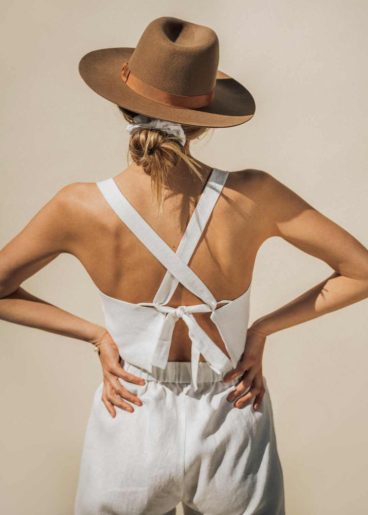 Backside of the Talia Tank in white linen. Paired with our white drawstring pants.