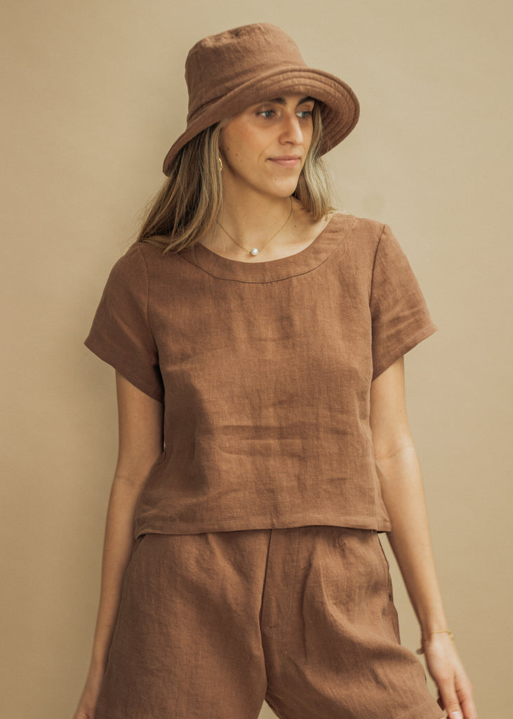 Our Augusta Set and Bronson Bucket Hat in Toffee. Made from 100% linen in Vancouver, BC and shot in studio.